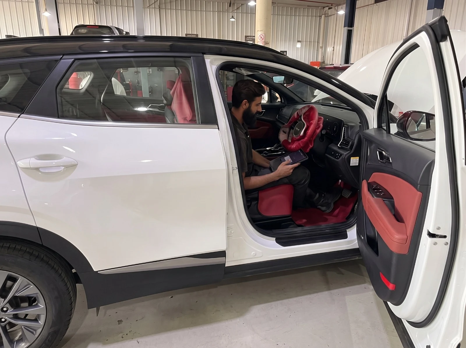 Pre-delivery inspection with Kia diagnostic tablet